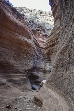 Tobas de Colores, Barranco de las Vacas, Gran Canaria, large mountains made of smooth and colorful stone.