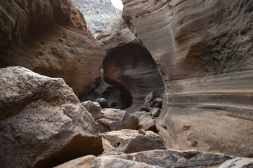 Tobas de Colores, Barranco de las Vacas, Gran Canaria, large mountains made of smooth and colorful stone.