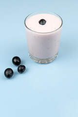 Yogurt in a glass glass with grapes