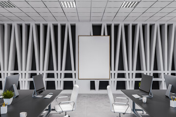 Modern white and gray open space office with poster