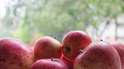 Group of apples on the background of the window