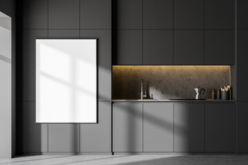 Minimalistic gray kitchen interior with cabinets and poster