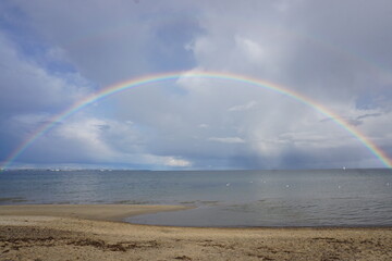 full double rainbow at seashore