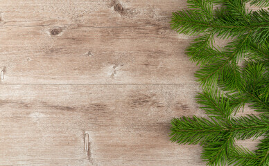 Fototapeta premium green Christmas tree on a wooden vintage background. xmas background.
