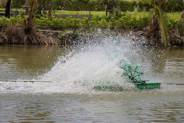 Water oxygen generator rotated on the pond. Water turbine fill oxygen into water in lake.