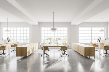 Modern white open space office corner with wooden tables, side view