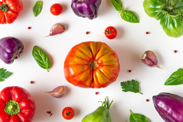 Tomato, basil, spices, pepper, garlic. Vegan diet food. Colorful organic tomato frame composition on white background