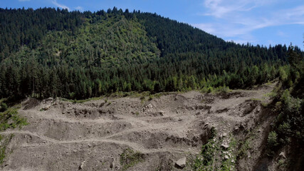 Sandy cliff with trees on it. Landscape of beautiful mountains. © DenisProduction.com