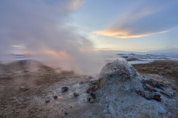 Steaming Geothermal Area Námaskarð at sunries in winter. North Iceland.