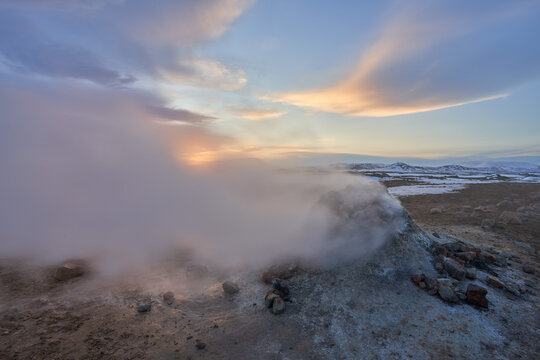 Steaming Geothermal Area Námaskarð at sunries in winter. North Iceland.