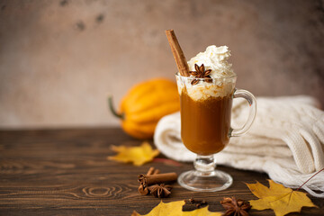 pumpkin latte with whipped cream and cinnamon