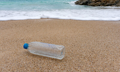 Plastic bottle waste is an environmental pollution on the beach