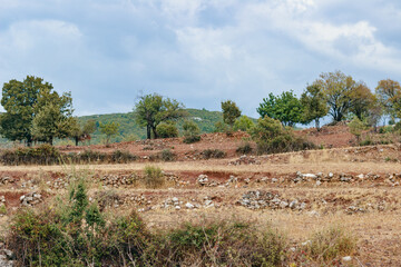 Fototapeta na wymiar Turkish rural landscape. View on red clay and stones