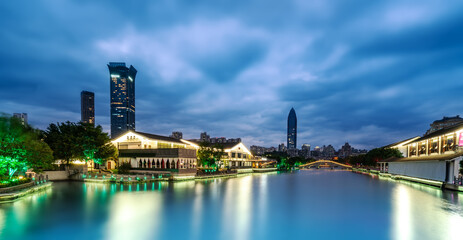 Fototapeta premium The night view of ancient buildings and modern urban buildings in Nantang Street, Wenzhou