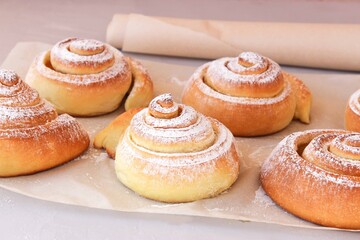 Soft, fluffy buns sprinkled with powdered sugar