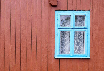 window the blue is painted on the brown painted wall. background