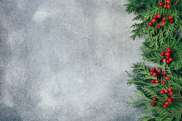 top view of branches of a christmas tree on a gray background