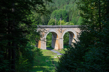 Fototapeta na wymiar Viaduct over the Adlitzgraben on the Semmering Railway. The Semmering Railway is the oldest mountain railway of Europe and a Unesco World Heritage site.