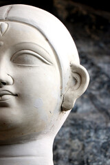 Dark eyes of maa Durga. Clay idol of Hindu Goddess Durga under preparations for Bengal's Durga Puja...