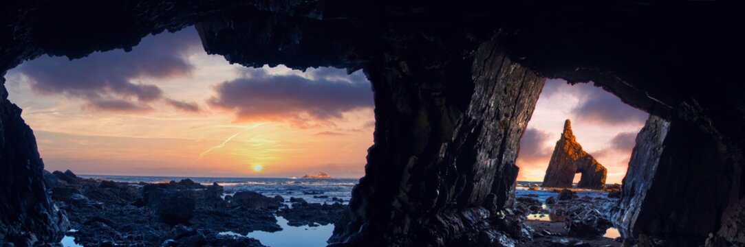Sunrise from inside the cave of Campiecho in Asturias, Spain.