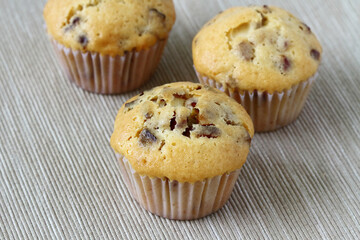 Thai style, dry banana muffin in paper cup piece on table cloth