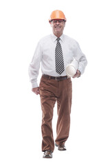 smiling architect striding towards you . isolated on a white