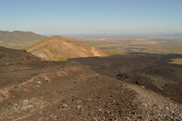 Hiking and snowboarding in the volcanic ashes on the Nicaraguan Volcanoes outside of Léon, Central America