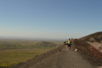 Hiking and snowboarding in the volcanic ashes on the Nicaraguan Volcanoes outside of Léon, Central America