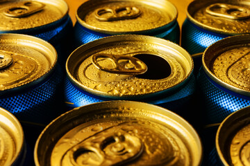 Golden beer can tops with water drops. Full and open canned cold drink. Drinking on the go beverages in cans with pull tabs. Yellow blue image for party concept.