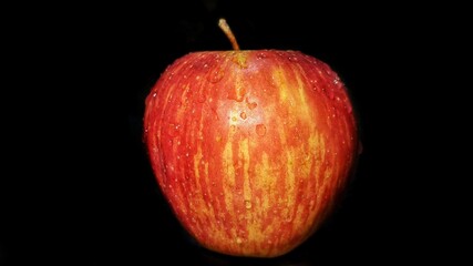 Red apple on black background