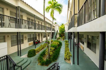 Apartments with colorful palm trees