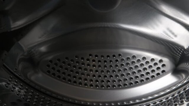 Drum of the washing machine. Washing machine drum empty.