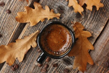 Espresso coffee and oak leaves on the table 