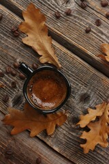 Espresso coffee and oak leaves on the table 
