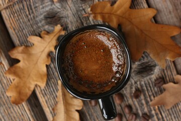 Espresso coffee and oak leaves on the table 