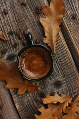 Espresso coffee and oak leaves on the table 