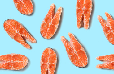 Top view of raw salmon steak isolated on blue background. Minimal concept.