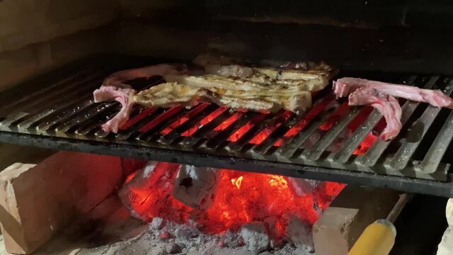 Close shot of meat roasting in a barbacue