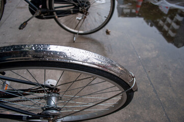 Naklejka na ściany i meble The wheel and mudguard of a vintage bike.