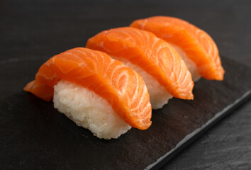 Slices of Raw Salmon Fillet on Black Background Mockup Top View