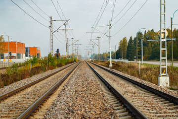 Obraz premium Two lane railroad with electric power lines