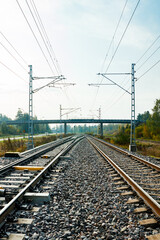 Fototapeta na wymiar Two lane railroad with electric power lines