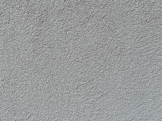 part of a relief concrete wall with spots - surface texture
