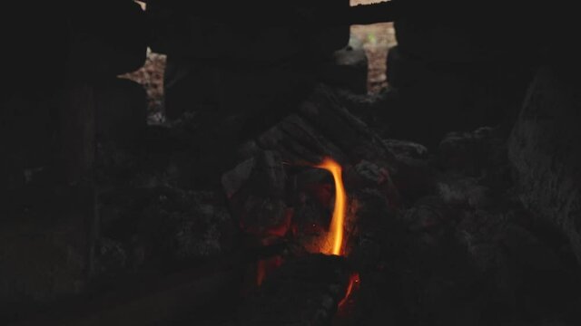 Boiling Sugarcane Juice Over Fire in Slow Motion Moonshine Distillery in the Galapagos Islands