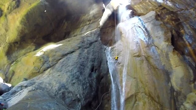Rappelling down the Bras Rouge canyon, one of the most beautiful in Reunion Island, the paradise of canyoning.