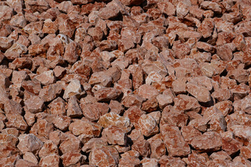 Marble brown pebble background close up. Textures and backgrounds. selective focus.