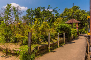 Fototapeta na wymiar A view approaching the station at Gangoda on the Kandy to Columbo main line railway in Sri Lanka, Asia