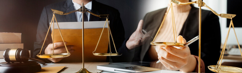 justice and law concept.Male judge in a courtroom on wooden table and Counselor or Male lawyer...