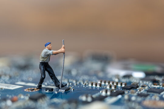 Miniature people working on cpu board, Technology concept