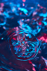 Splash of water from falling Kali, circles on the water, abstract pattern, frozen water splashes.